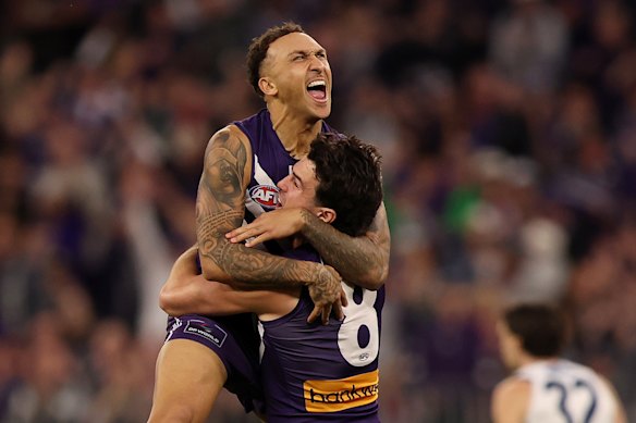 Bolton celebrates with Andrew Brayshaw after his magical goal inside the first two minutes of the semi-final against the Cats.