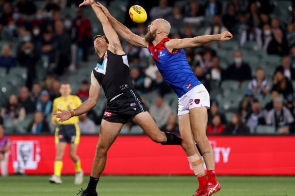 Scott Lycett and Max Gawn compete for the football.