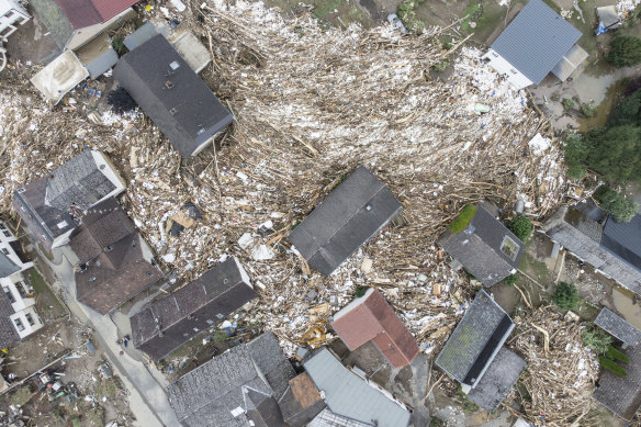 Debris between houses is seen close to the Ahr river in Schuld, Germany, on Thursday.
