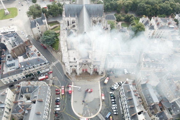 Firefighters work to extinguish the blaze at the Gothic St Peter and St Paul Cathedral in Nantes, France, on July 18.