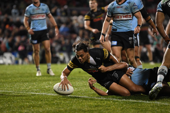 Jarome Luai crosses the line for the Panthers.