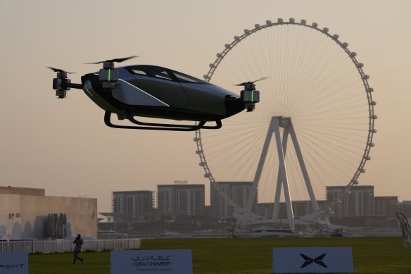 An XPeng X2 electric flying taxi, developed by the Guangzhou-based XPeng’s aviation affiliate, is tested in front of the Marina District in Dubai, United Arab Emirates, in October 2022. 