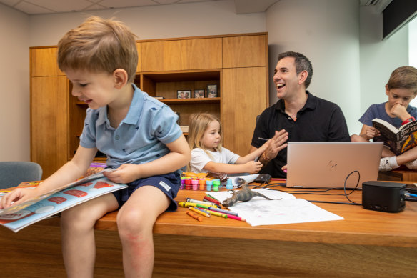 Treasurer Jim Chalmers prepares for the budget with children Jack, 3 (left), Annabel, 5, and Leo, 7, in Brisbane on Saturday.