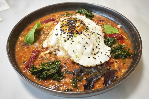 Yunnanese “bolognese” on rice, topped with a fried egg.