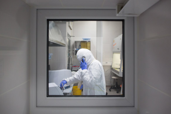 A lab technician performaing a swab testing process to identify COVID-19 at the Invitro LLC laboratory in Moscow, Russia.