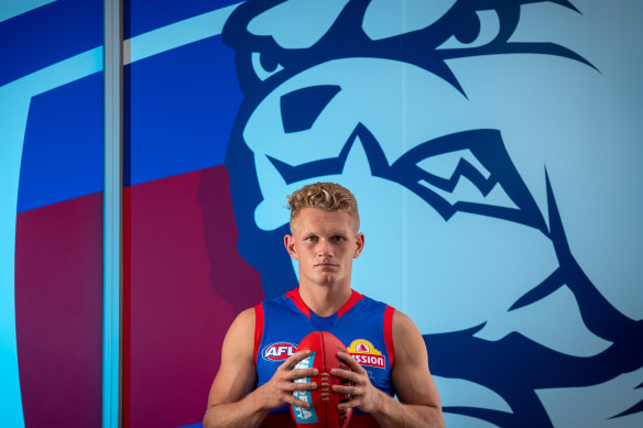 Adam Treloar poses for a photo in his new team colours.