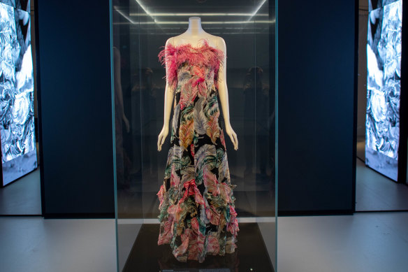 A printed 1939 evening dress with pink ostrich feathers, on loan from Sydney’s Museum of Applied Arts and Sciences.