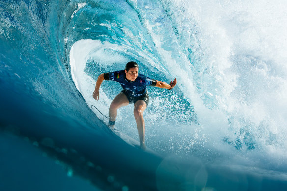 Tyler Wright tucks into a Pipeline barrel.
