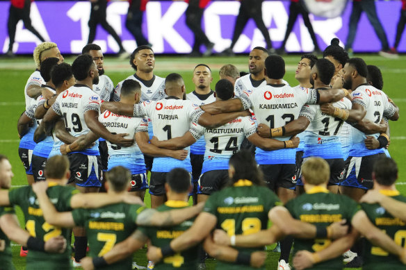 Fiji’s players sing a prayer before the start of their Rugby League World Cup match against Australia.