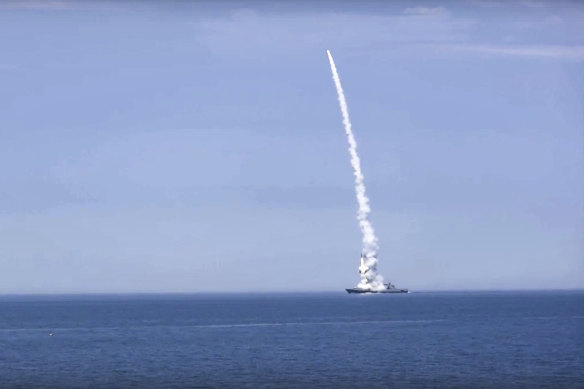 A Russian warship launches a cruise missile at a target in Ukraine.
