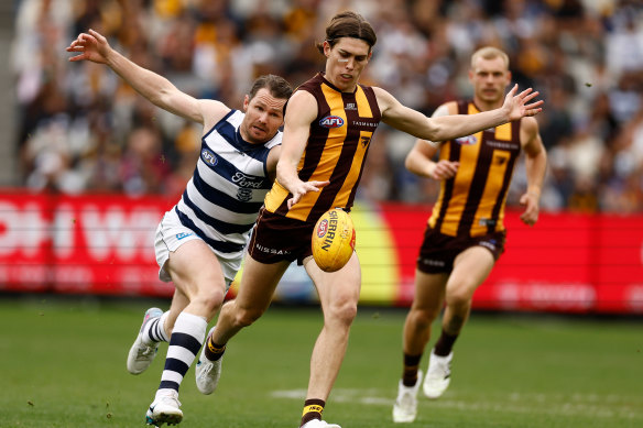 Will Day gets a kick away against Geelong.