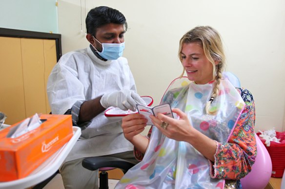 A dentist in Varkala, India with a patient. File photo.