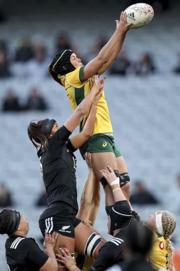 Tall timber: Emily Chancellor jumps in a lineout during Australia's clash with New Zealand last month