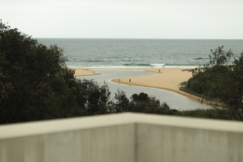 The house is a stone’s throw from Curl Curl Lagoon and has glimpses of the Pacific Ocean.