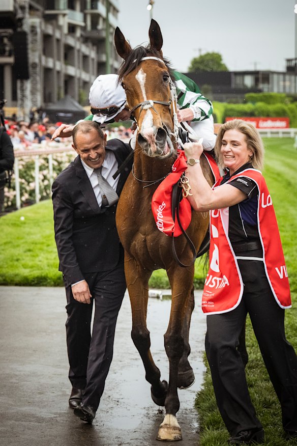 The winning horse, Via Sistina, with trainer Chris Waller.