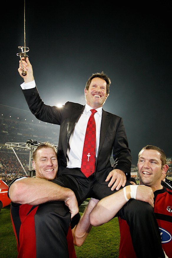 A long time coming: Thorn, left, helps hold aloft Crusaders coach Robbie Deans after their Super 14 final victory over the Waratahs in 2008. 