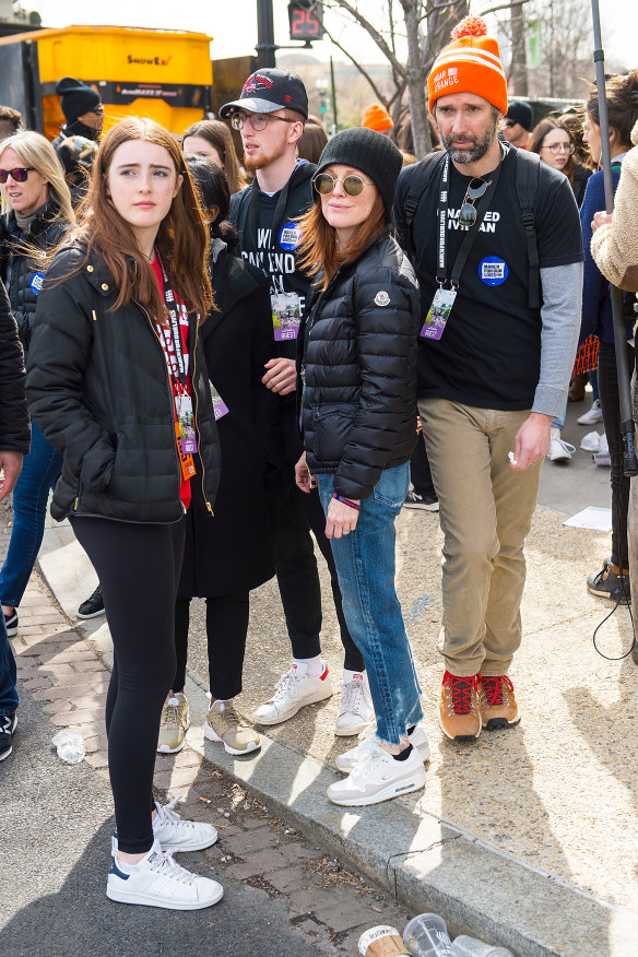 Flanked by her husband, Bart Freundlich and children, Liv and Caleb, while attending the March For Our Lives event in 2018.