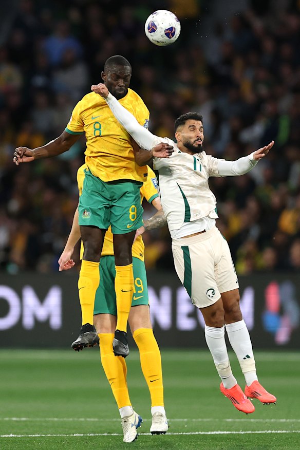 Jason Geria leaps for a header against Saudi Arabia.
