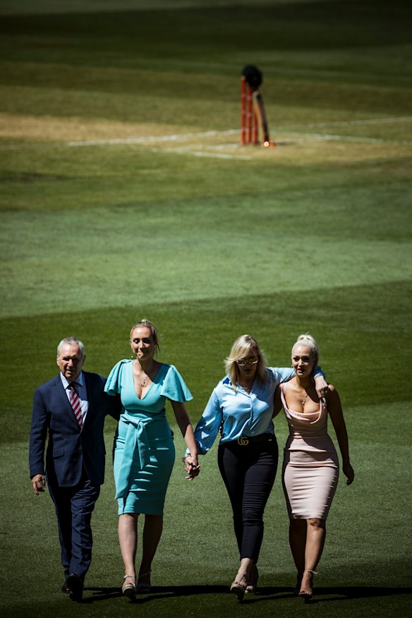 Allan Border, Phoebe Jones, Jane Jones and Augusta Jones with Deano's bat and baggy green at the wicket.