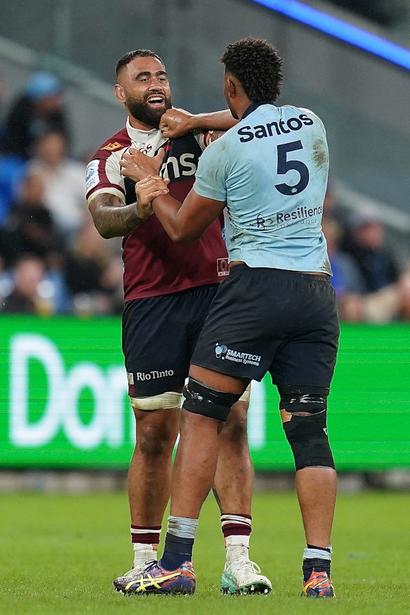 Miles Amatosero tangles with Lukhan Salakaia-Loto in the last Waratahs-Reds clash, in round 13 last year.