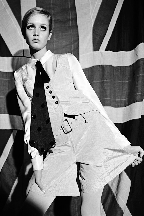 Twiggy models a Mary Quant waistcoat and shirt ensemble in 1966.
