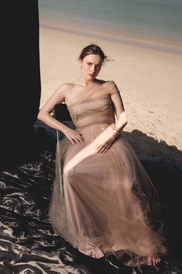 Dress by Christian Dior, rings by Bulgari.