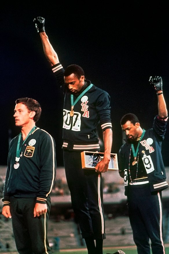 Peter Norman, Tommie Smith and John Carlos on the podium in Mexico.