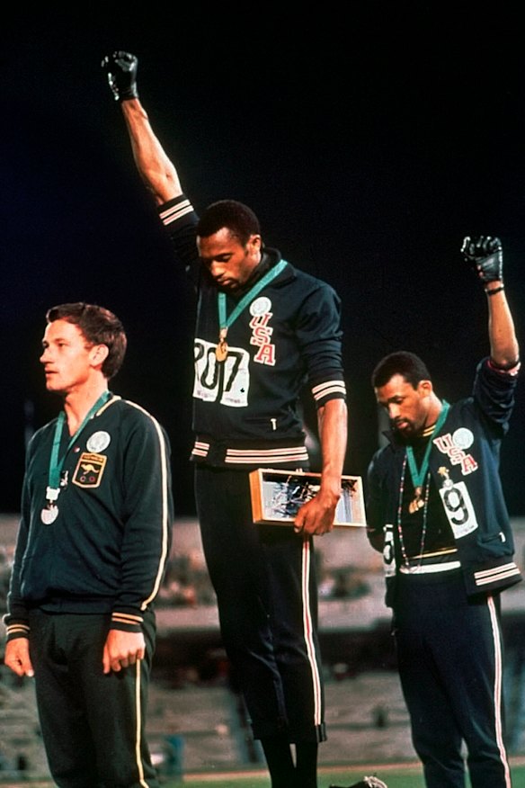 Peter Norman, Tommie Smith and John Carlos on the podium in Mexico.