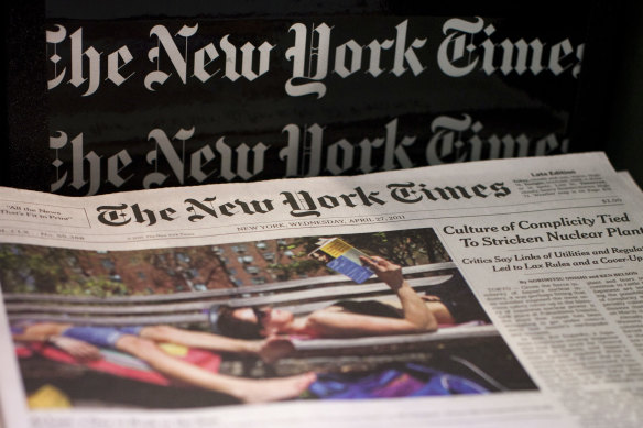 Copies of The New York Times on the newsstand.