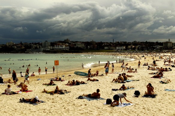 Storm rolls into Sydney as sun lovers soak up the last sun rays at Bondi Beach.
 