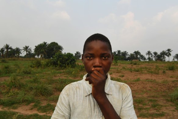Former child soldier Olivier at a farm that is run by a local organisation helping teenagers and young men, including former militia members to learn a trade.