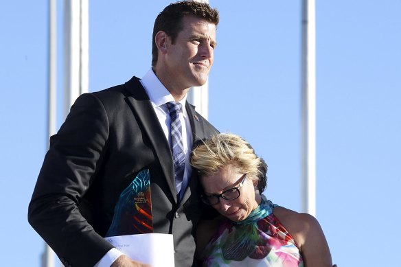 Rosie Batty, having just been announced as 2015 Australian of the Year, is comforted by Ben Roberts-Smith, Chair of the National Australia Day Council.