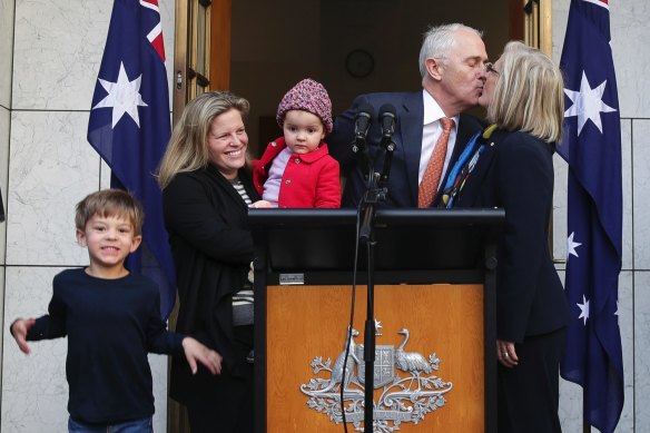 Outgoing PM Malcolm Turnbull addresses the media after the partyroom meeting for the leadership spill, with his wife Lucy, daughter Daisy and grandchildren Jack and Alice on August 24, 2018.