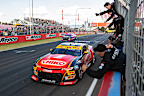 2024 Bathurst 1000 winner Brodie Kostecki and Todd Hazelwood cross the finish line to cheers from their team. 