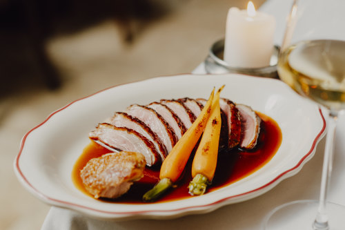 Duck a l’orange, the slices of rosy pink breast lapped by an orange scented glaze.