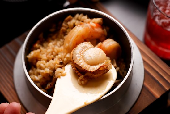 Seafood kamameshi with umami soup.