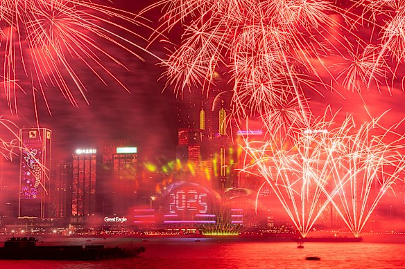 Fireworks explode over Victoria Harbour to celebrate the start of 2025 at Tsim Sha Tsui in Hong Kong.