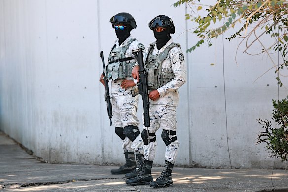 National Guard officers stand guard outside the Fiscalia Especializada en Materia de Delincuencia Organizada on February 23, 2026, in Mexico City, Mexico. The Secretariat of National Defense of Mexico confirmed that during a security operation in Tapalpa, Jalisco,  Nemesio Oseguera Cervantes, known as ‘El Mencho’, leader of the Jalisco New Generation Cartel, was killed, along with four other members.