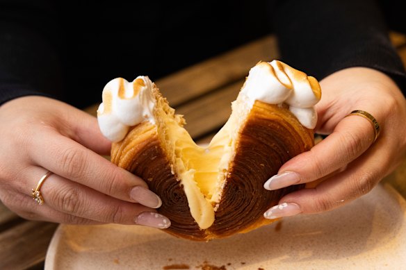 The circular pastries are filled with custard, which changes flavour each month.