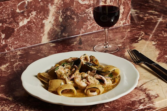 Scoglio calamarta pasta with calamari, vongole, prawn and more.