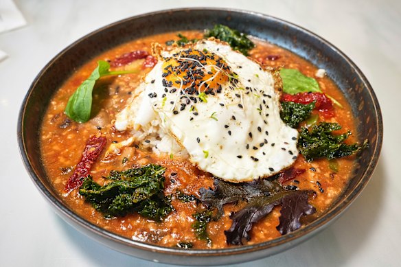 Yunnanese “bolognese” on rice, topped with a fried egg.