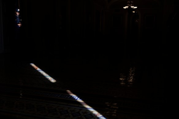 A U.S. Capitol Police officer stands his post outside the Senate Chamber on Capitol Hill in Washington.