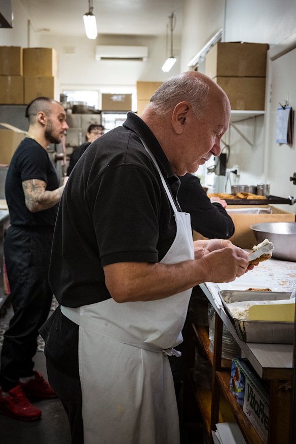 Tony Cavallaro fills cannoli with ricotta. 