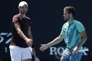 Nikola Mektic and Mate Pavic talk tactics in their first-round doubles win during day four of the 2022 Australian Open at Melbourne Park.