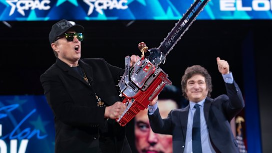 Elon Musk with the chainsaw he was given by Argentinian President Javier Milei at a recent conference in the US.