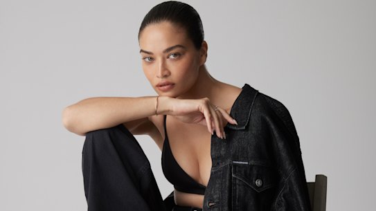 Shanina wears Calvin Klein jacket, $199, and jeans, $199, Coach bralette, $199.