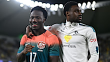 Nestory Irankunda of Australia and Yaya Dukuly.