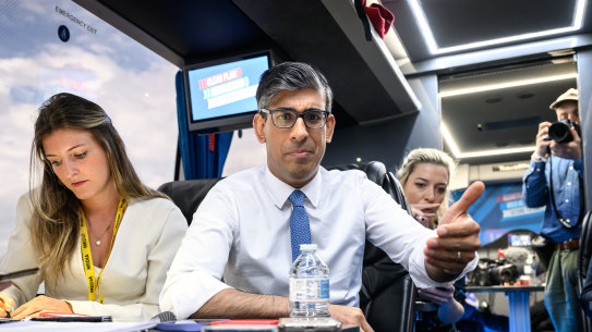 Prime Minister Rishi Sunak speaks to journalists on the campaign bus.