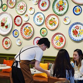 Walls feature plates used for Lunar New Year celebrations by families in Thailand.