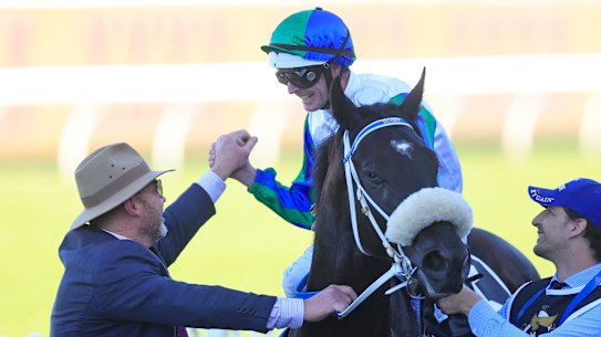 Luke Nolen greets trainer Peter Moody on I Wish I Win after they claimed the Golden Eagle.